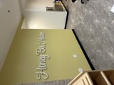 Custom branded wall lettering installed in a commercial interior by CBI Lighting in Pittsburgh